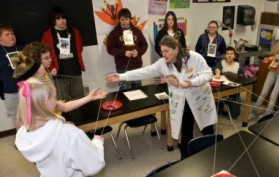 teacher conduction activity with students in classroom