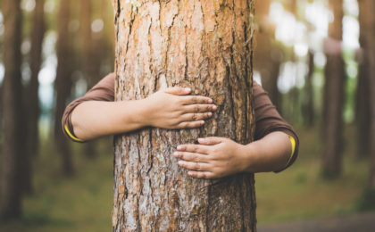 Woman hug the tree with love