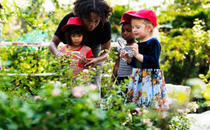 Teacher and kids school learning ecology gardening