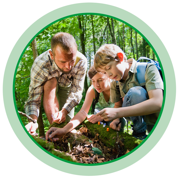 Kids taking soil sample in forest