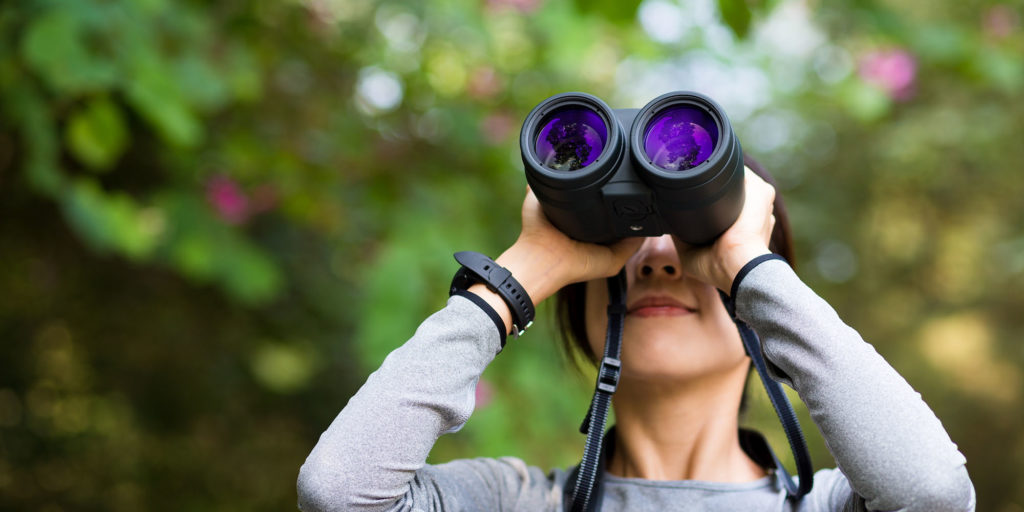 young girl with binoculars
